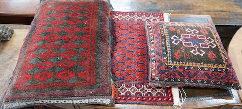 Two Caucasian cushions, larger 67 x 45cm together with a bag face